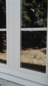 isolation par double-vitrage sur fenêtres bois